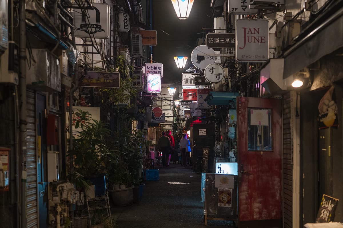 Golden Gai alley at night with tiny bars