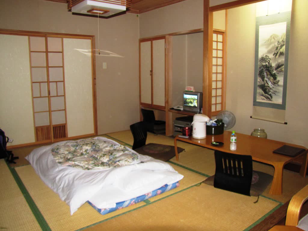 Traditional minshuku tatami-room interior with futons