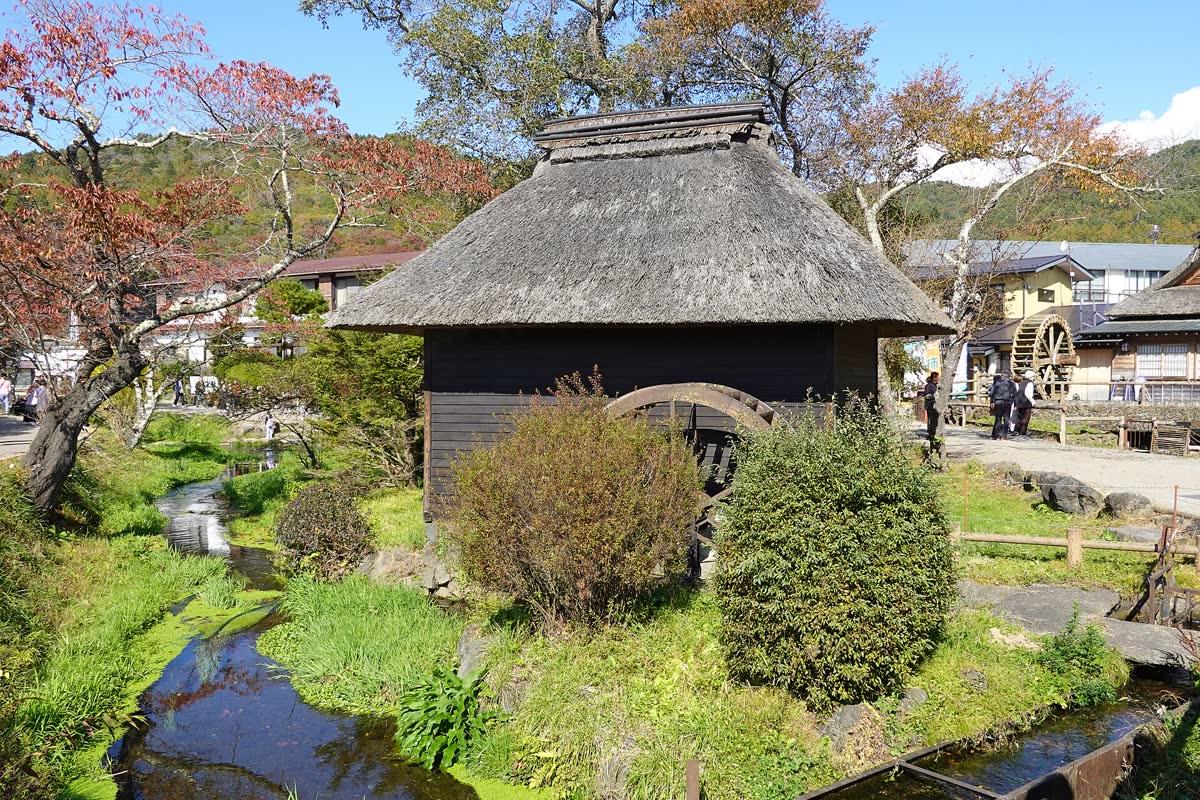 Thatched-roof village at Oshino Hakkai with Mt Fuji